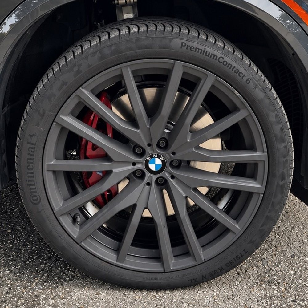 Before: BMW wheel with a dull, dusty finish